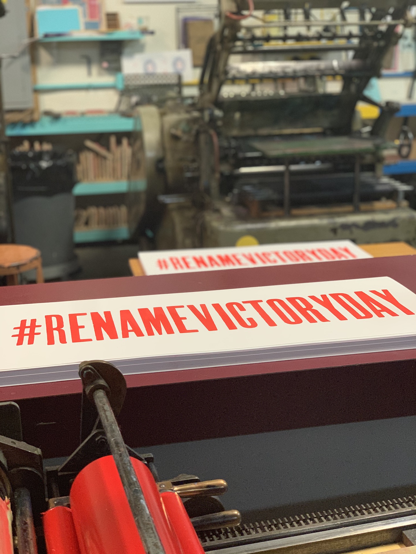 Victory Day by Lois Harada Small hashtag print "#RenameVictoryDay" set in a letterpress studio