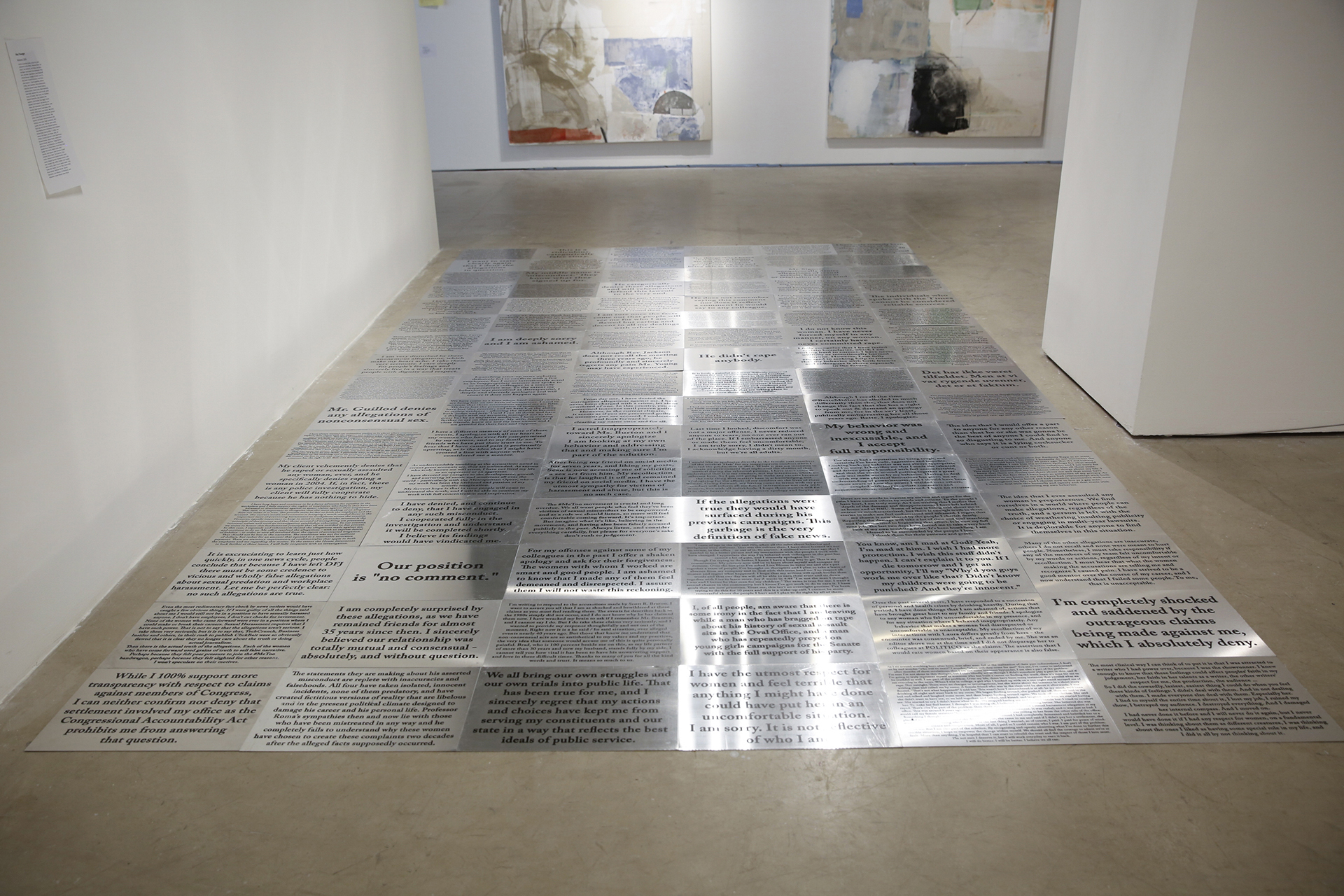 146 hand cut aluminum plates, screenprinted with the statements made by each public figure accused of sexual assault or harassment since Harvey Weinstein 96 plates shown displayed, erased through public interaction and maintained through performances to replace erased plates