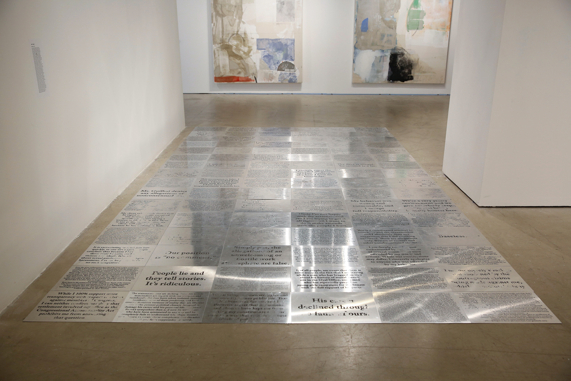 146 hand cut aluminum plates, screenprinted with the statements made by each public figure accused of sexual assault or harassment since Harvey Weinstein 96 plates shown displayed, erased through public interaction and maintained through performances to replace erased plates