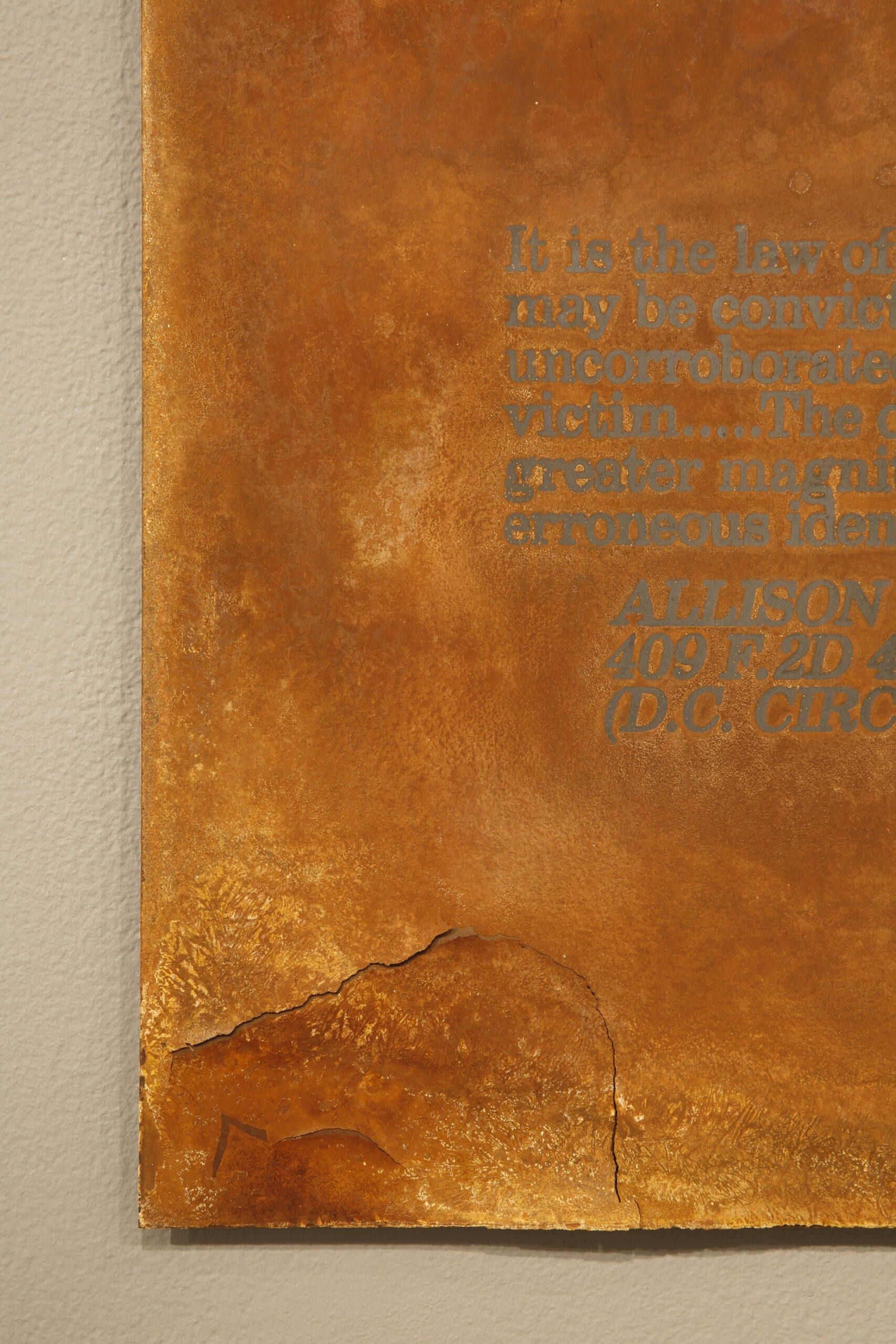 Screenprint resist on steel with rust patina, text from 1969 DC Circuit Court ruling on the attempted rape of an eleven-year-old girl