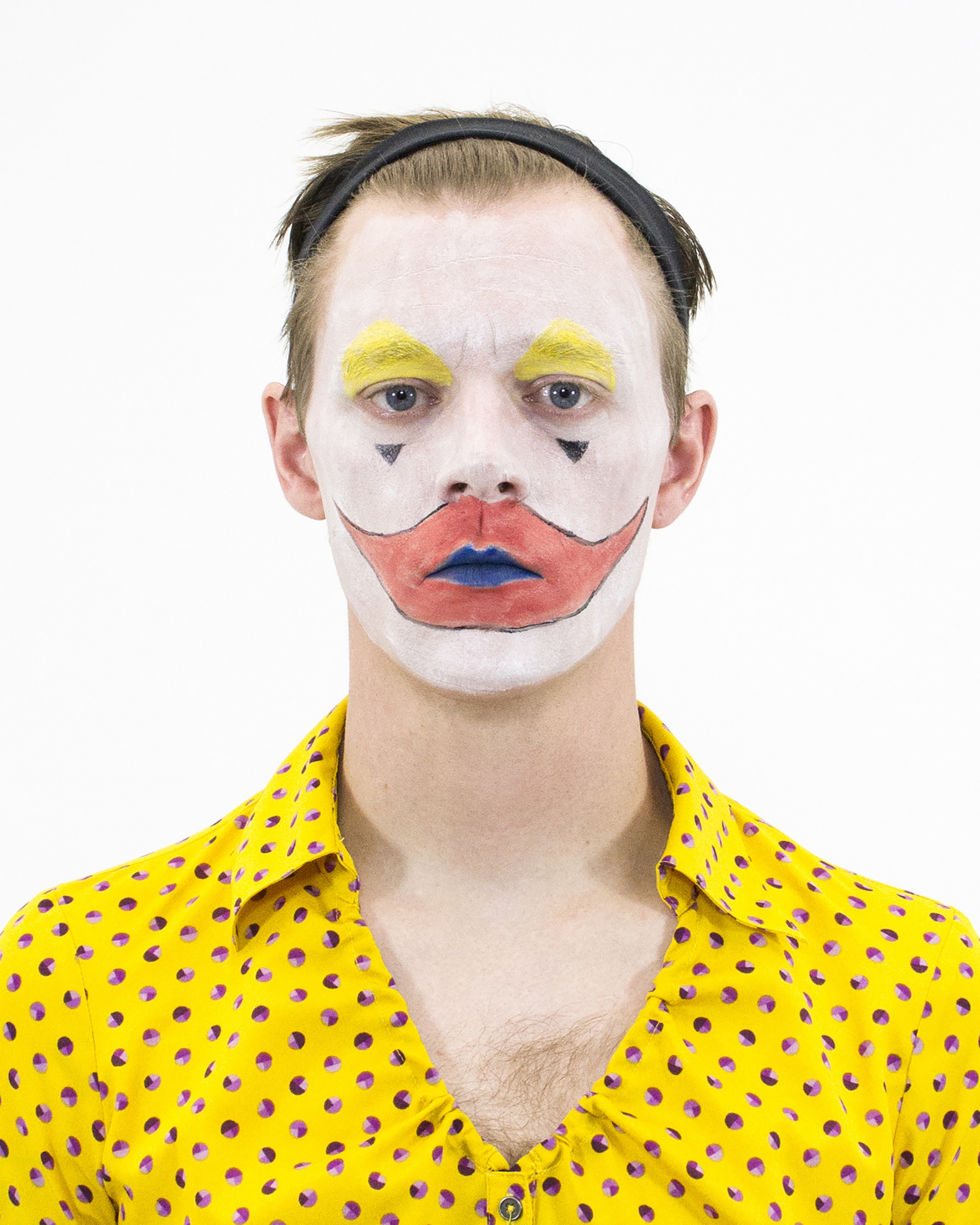 Photo of the artist in clown makeup