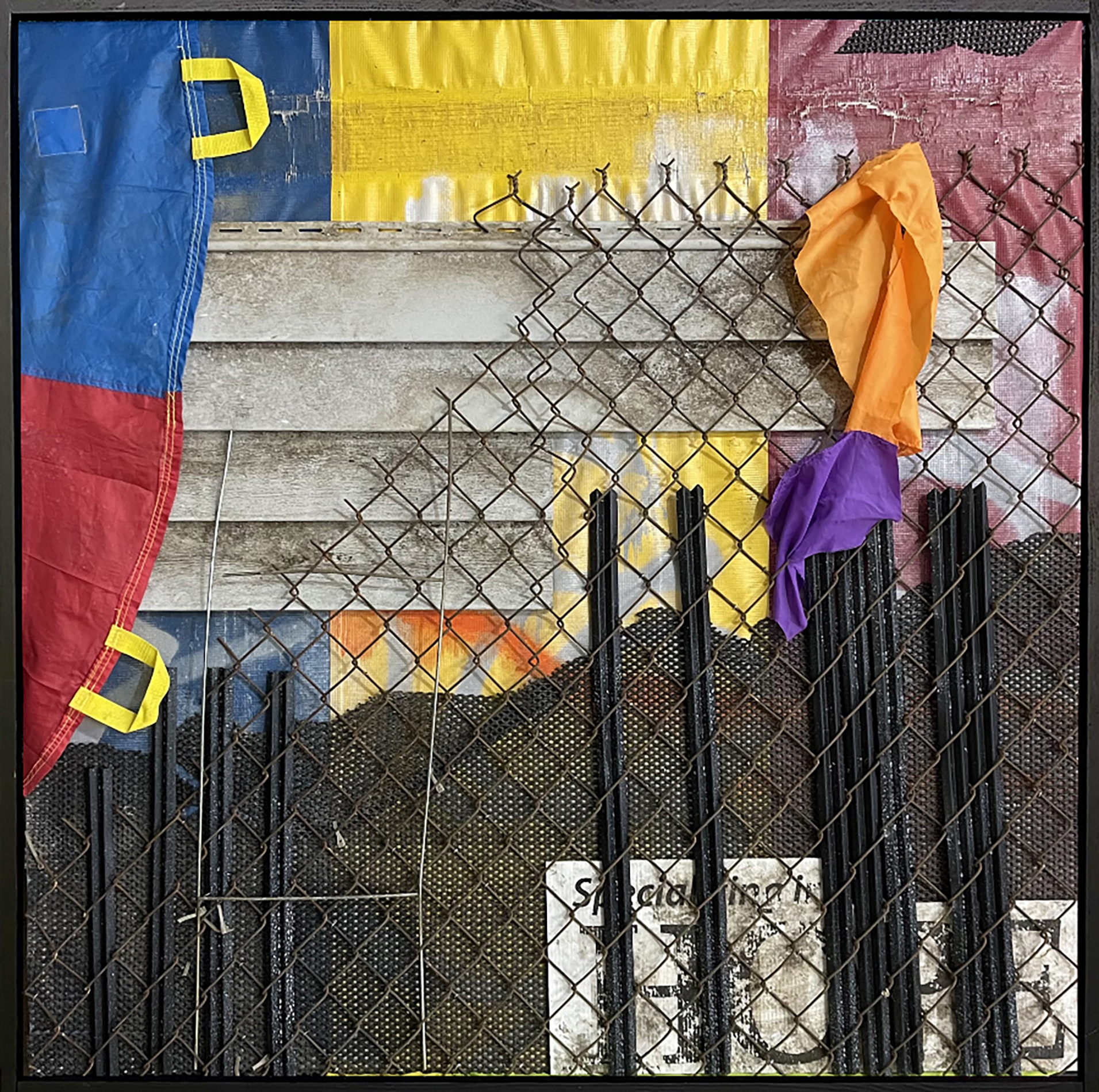 Specializing in Hope, by Aaron Coleman. A mixed media assemblage made from commercial fencing, salvaged tarps and siding, and gym parachutes.