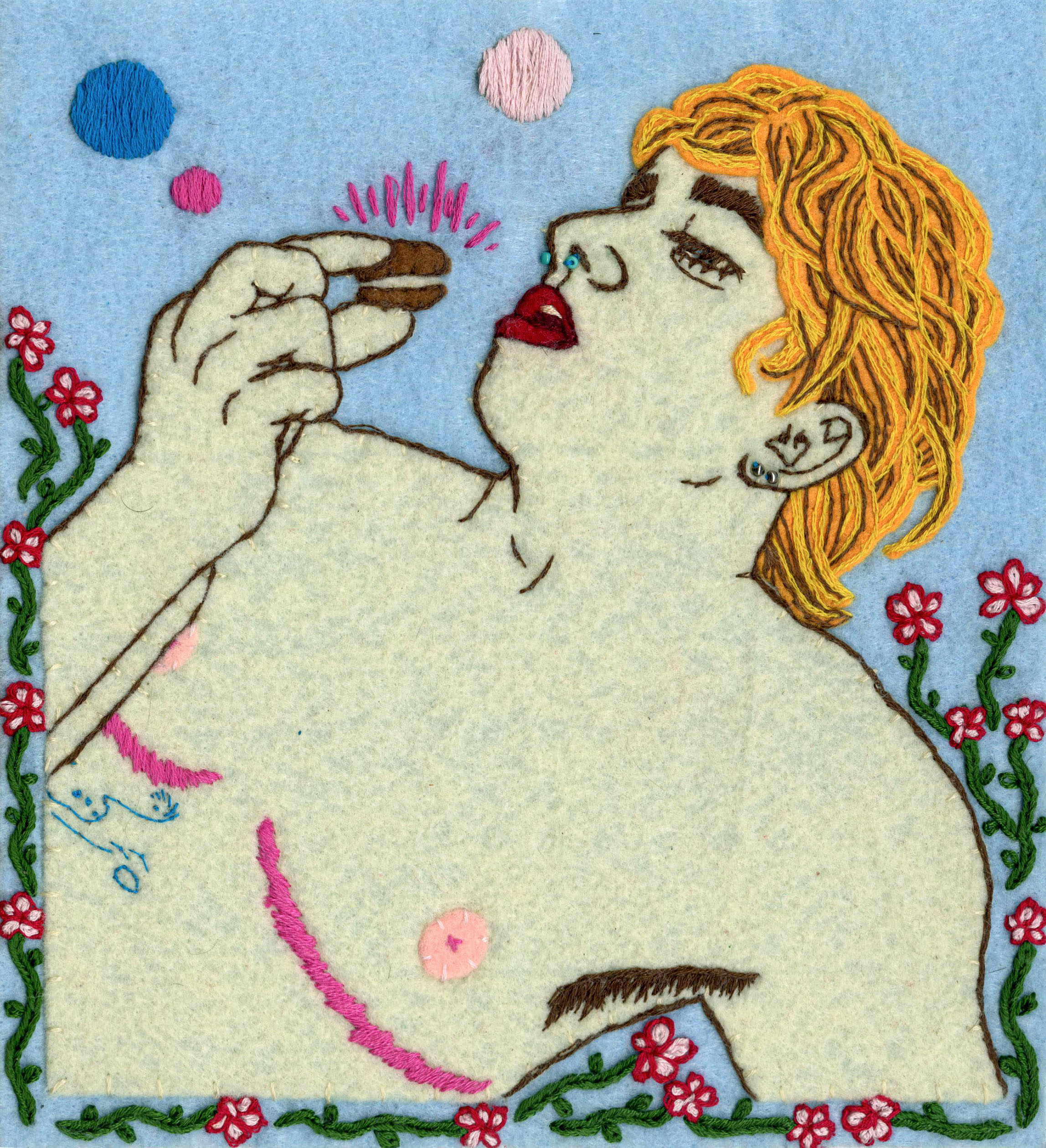 An embroidered felt reclining figure with top surgery scars eats a macaron surrounded by flowers and circles