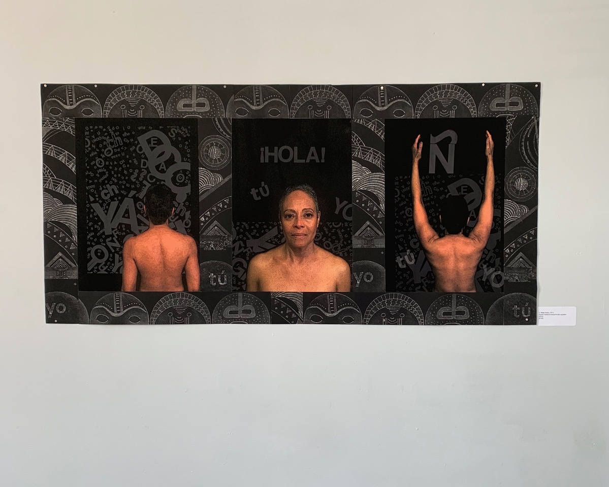 A triptych of the artist unclothed. In the right panel the figure with her back to the audience, raises her hands to the sky. In the background of each panel is text in Spanish and Taino. Surrounding each panel are Taino tribal motifs.