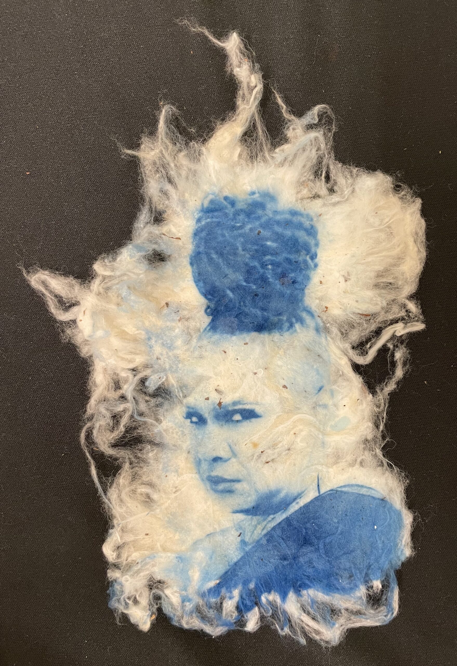 A photo intaglio portrait in indigo printed on raw cotton