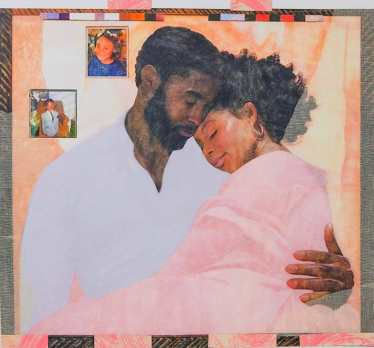 Two figures embrace surrounded by decorative papers and photos of the couple as children.