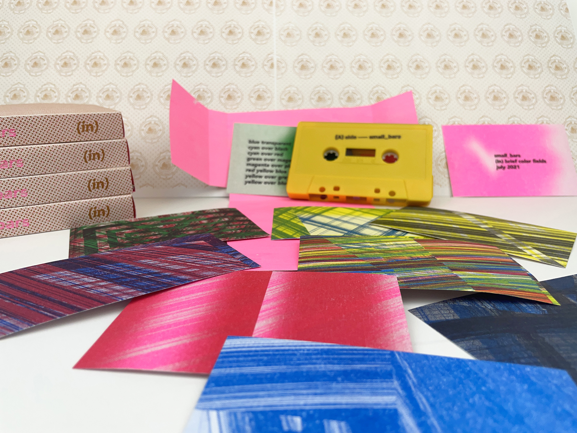06_small_bars A column of paper cartons of "Girl Juice", an alternative to typical hormone therapy, printed in a pink motif.