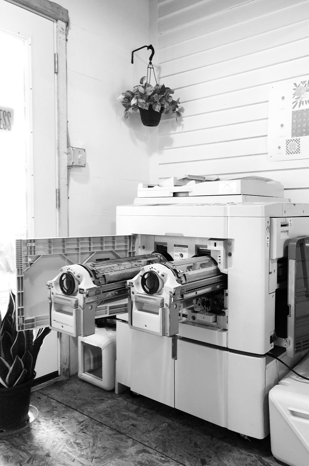 DirectangleRiso An etching press sits in front of a slab and pegboard workspace at Atabeira Press.