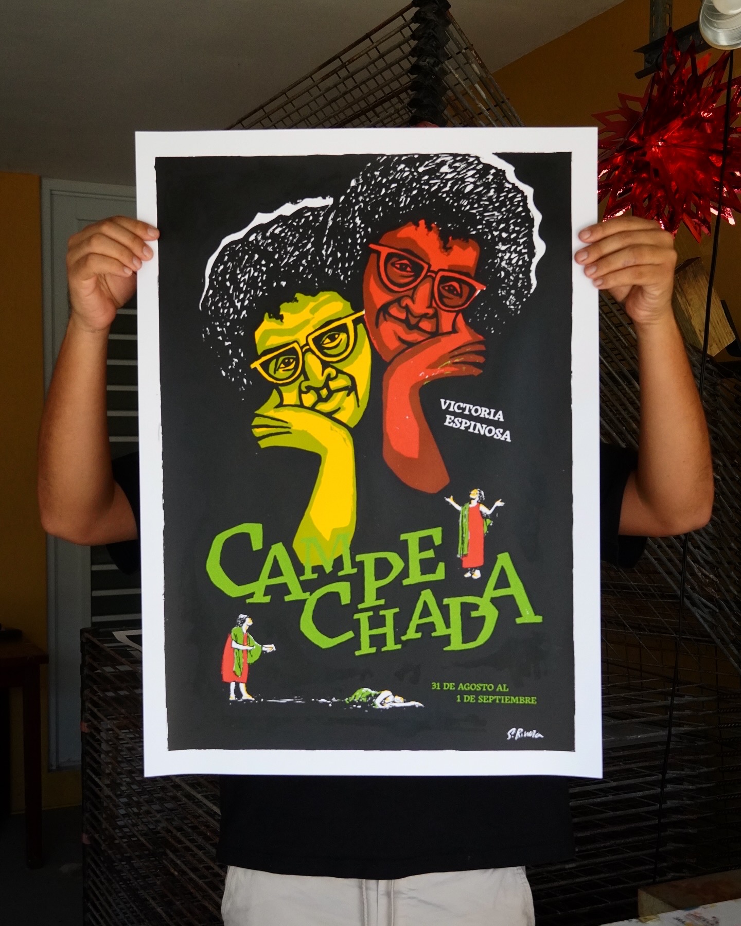 A poster like print of two curly headed figures in glasses