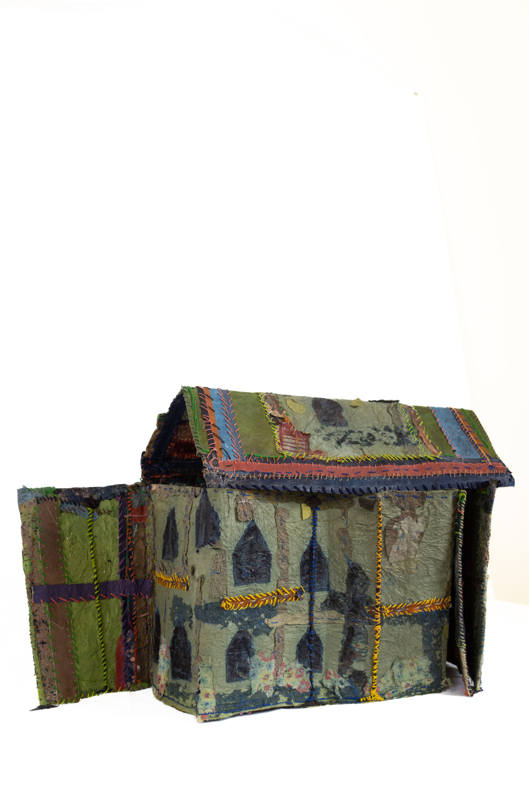 An etching press sits in front of a slab and pegboard workspace at Atabeira Press.