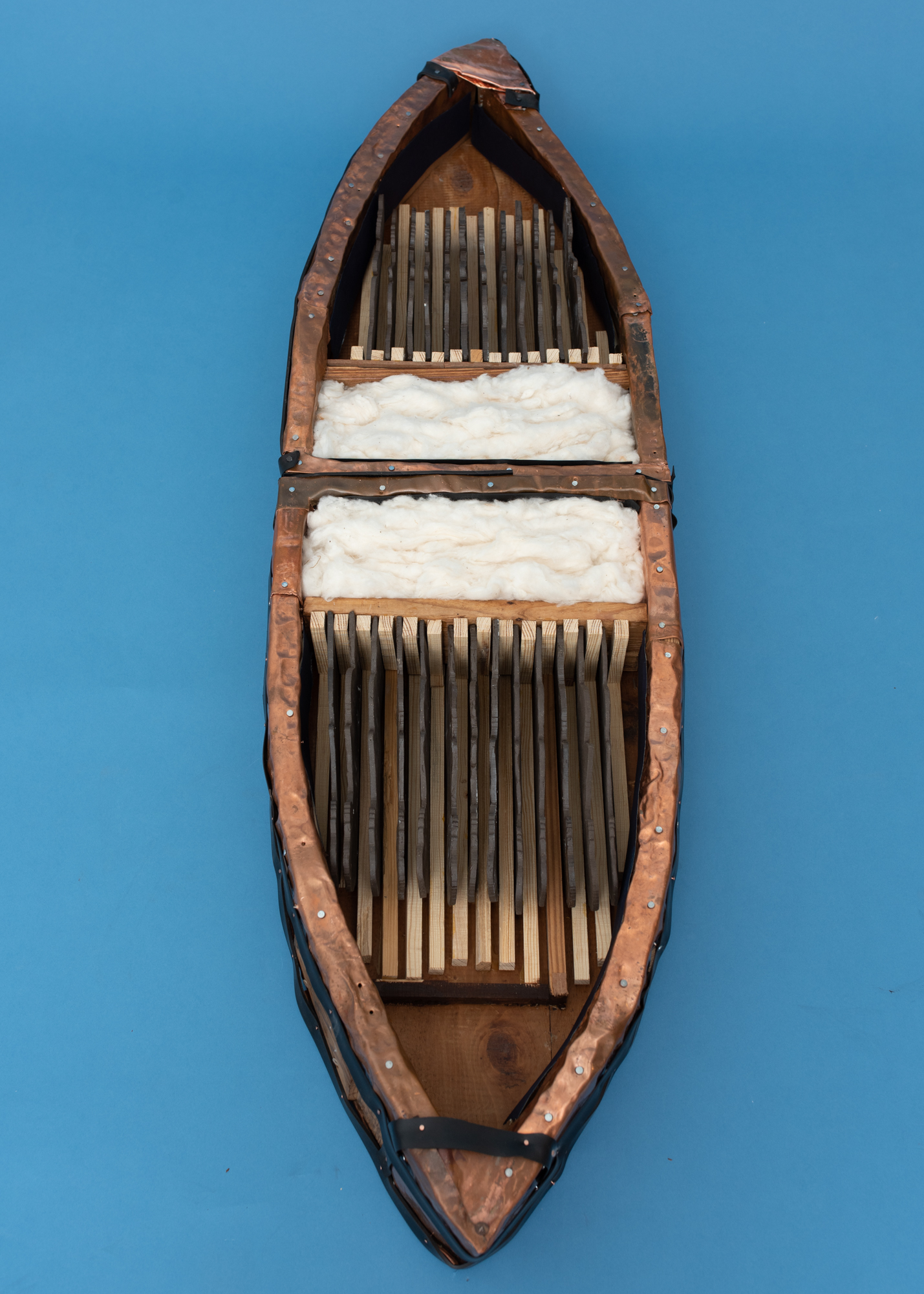 A composition shaped like an arched windows with shutters thrown open is filled primarily with textures like window slats and botanicals. In the center is a panel with an older woman, the artist's aunt, in white.