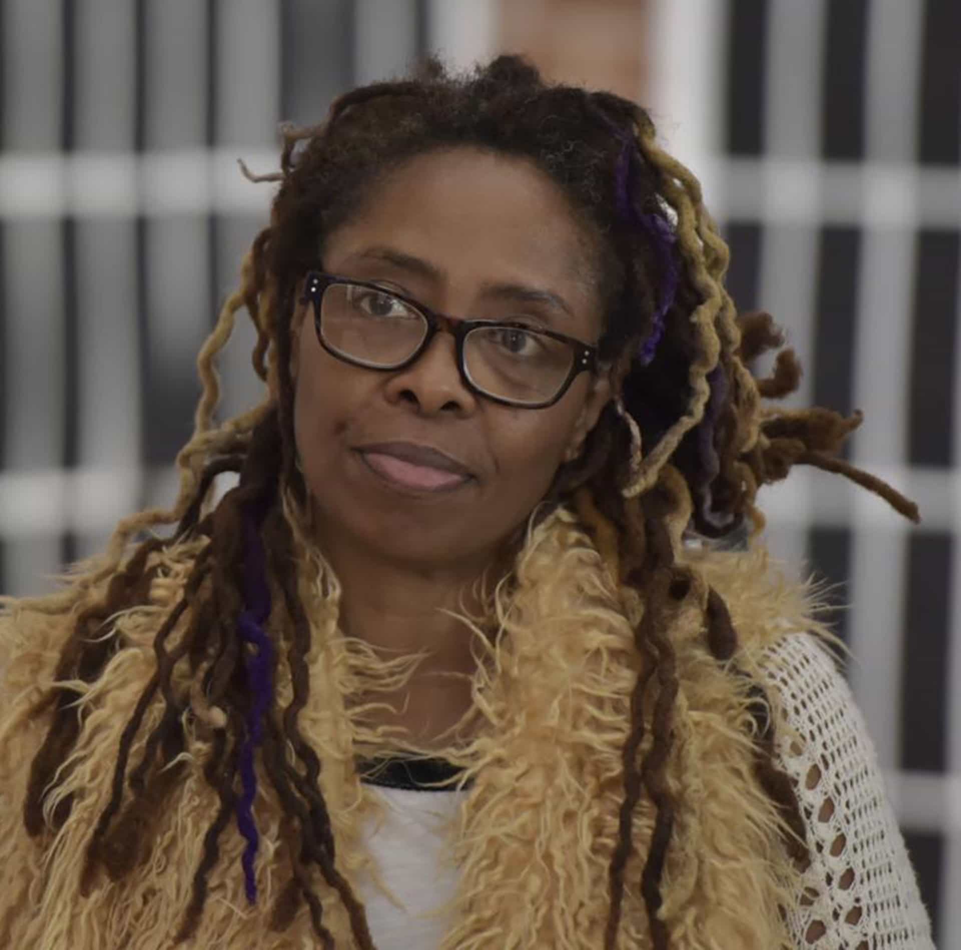 photo of artist, Jennifer Graves in front of her work