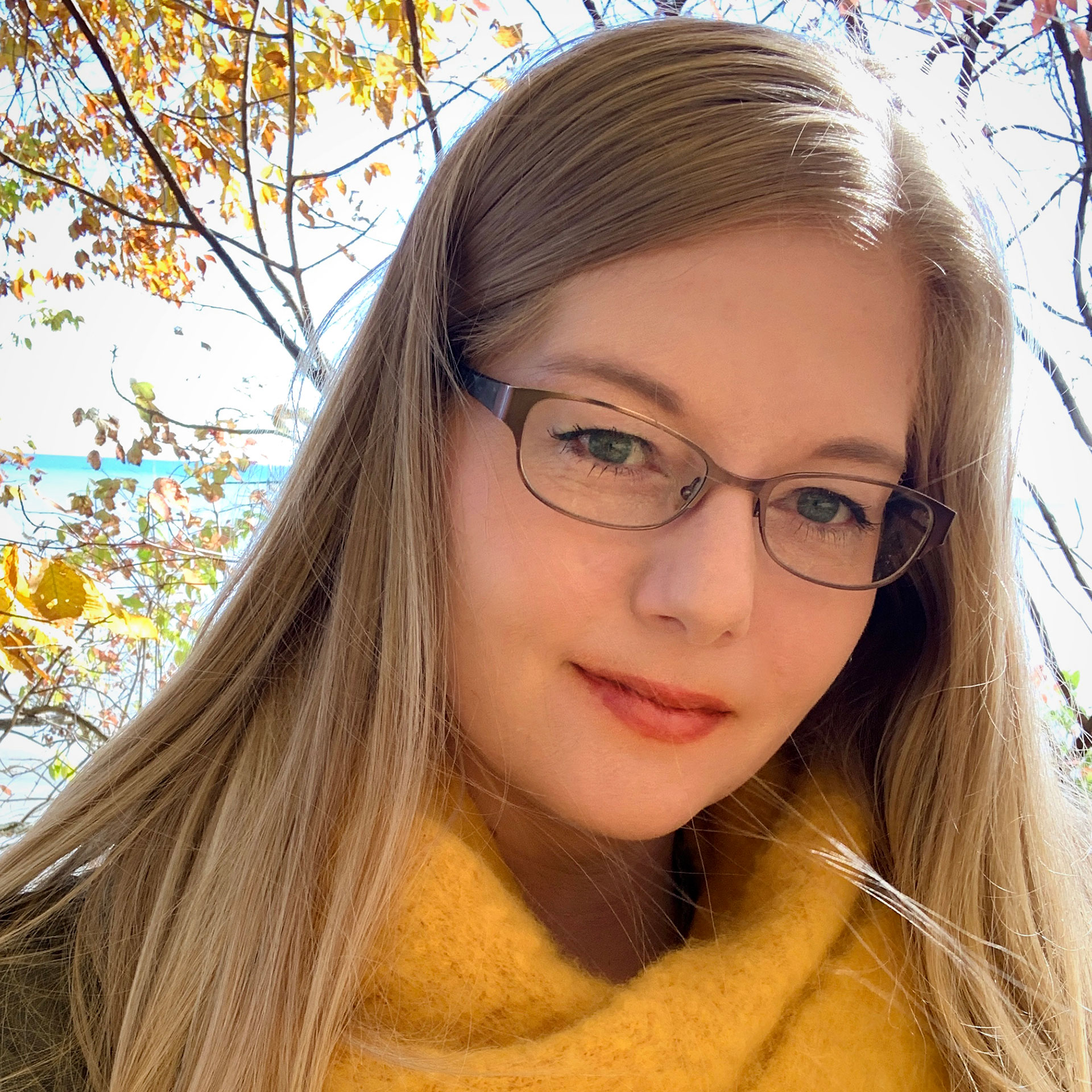 Photo of artist, Lauren Emeritz at a platen press