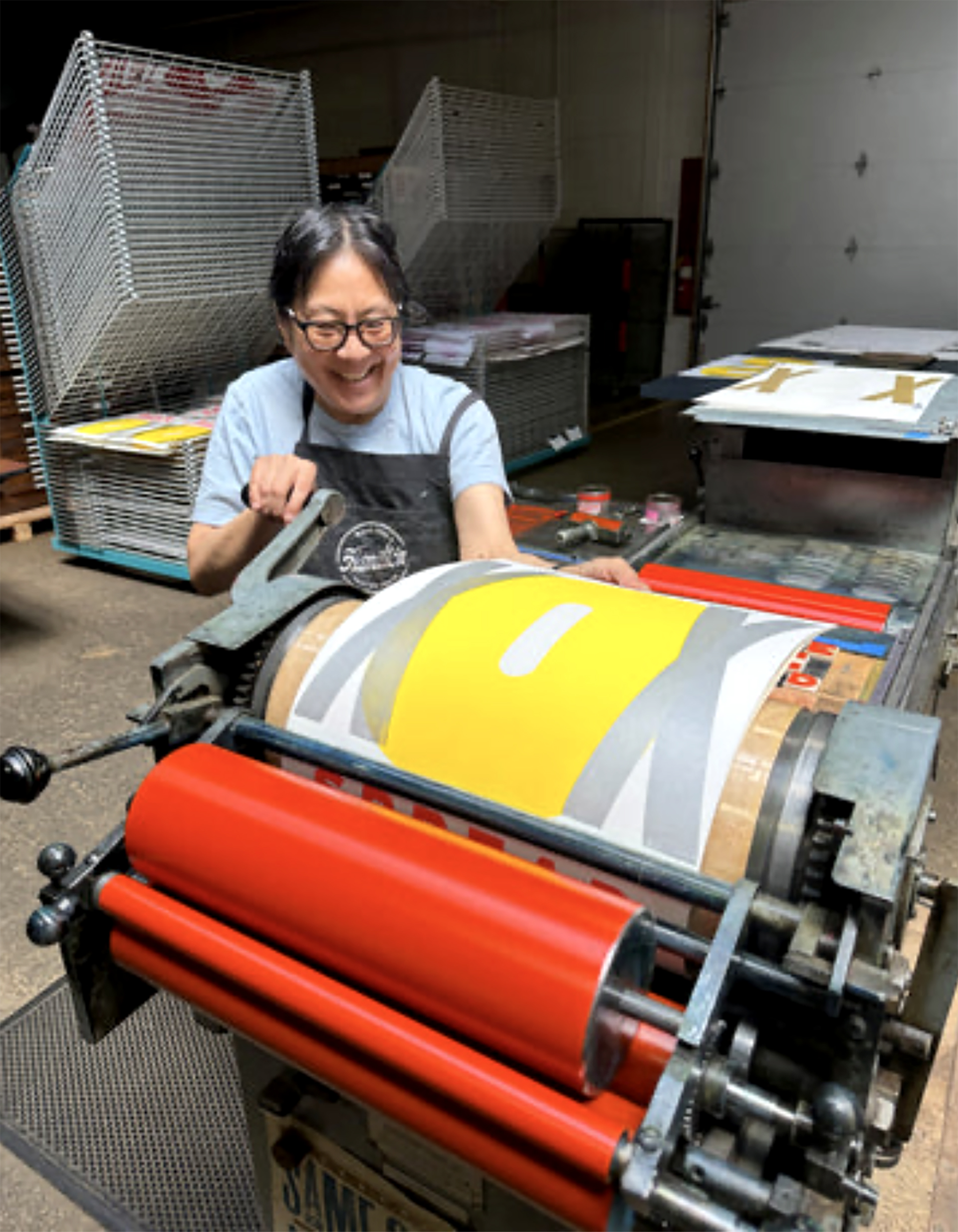 photo of artist, Jennifer Graves in front of her work