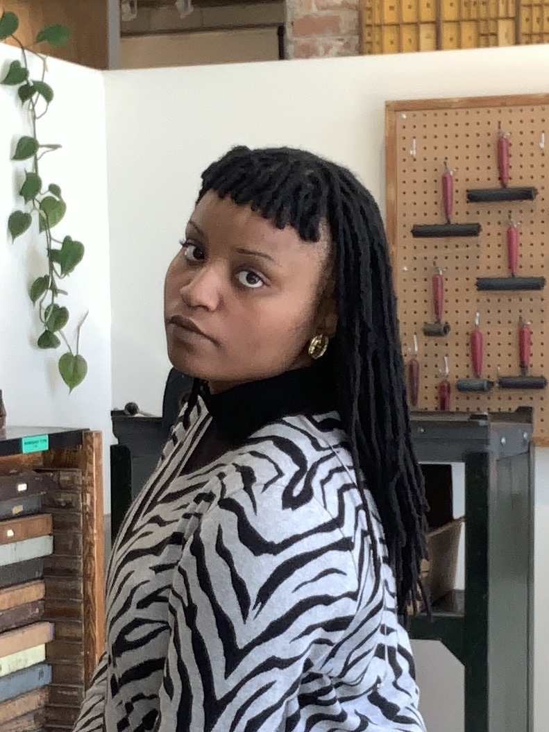 photo of artist, Jennifer Graves in front of her work