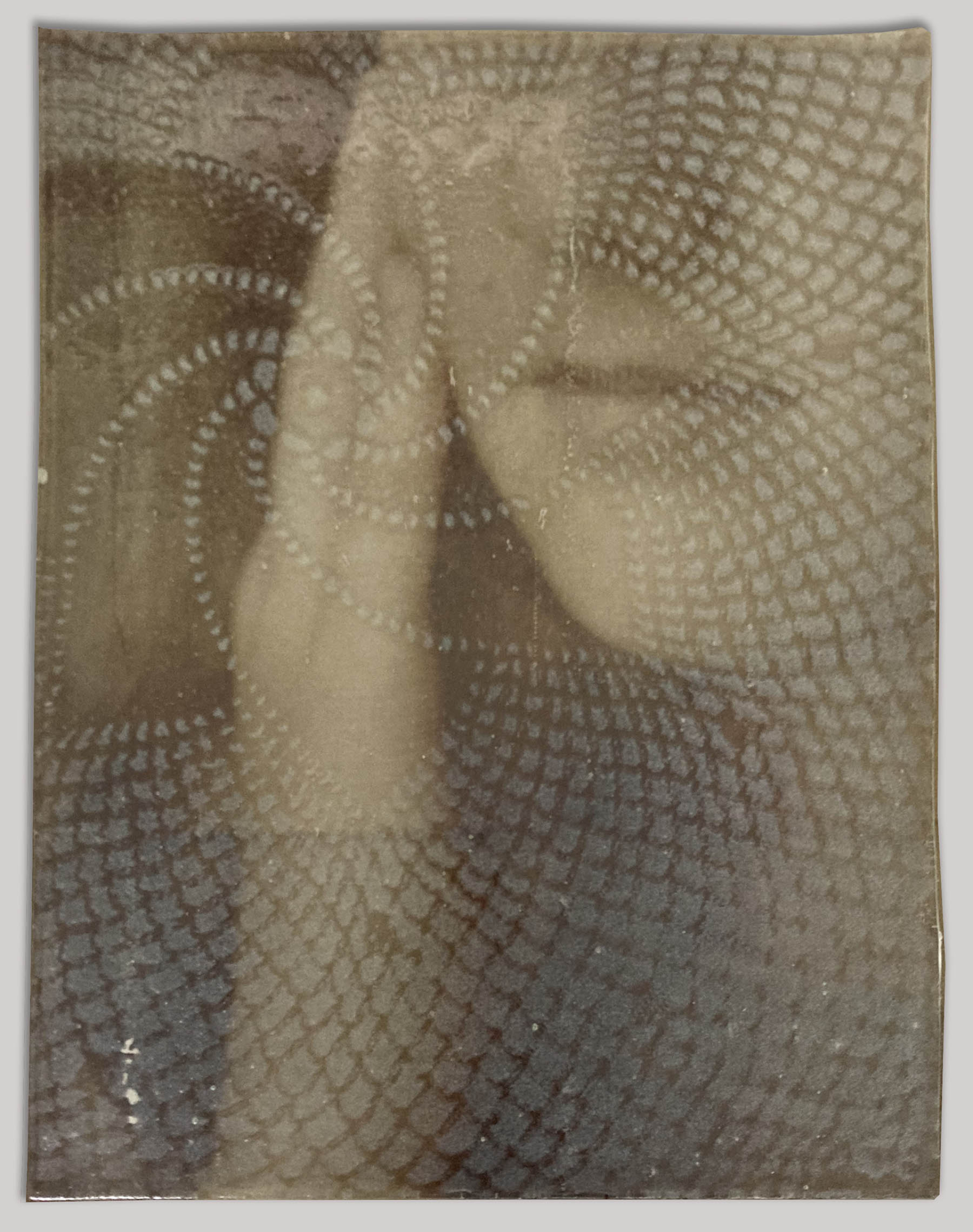 An abstract shape based on an abstracted EKG of a panic attack and given form. Inside this shape is a fluorescent pink wave pattern.