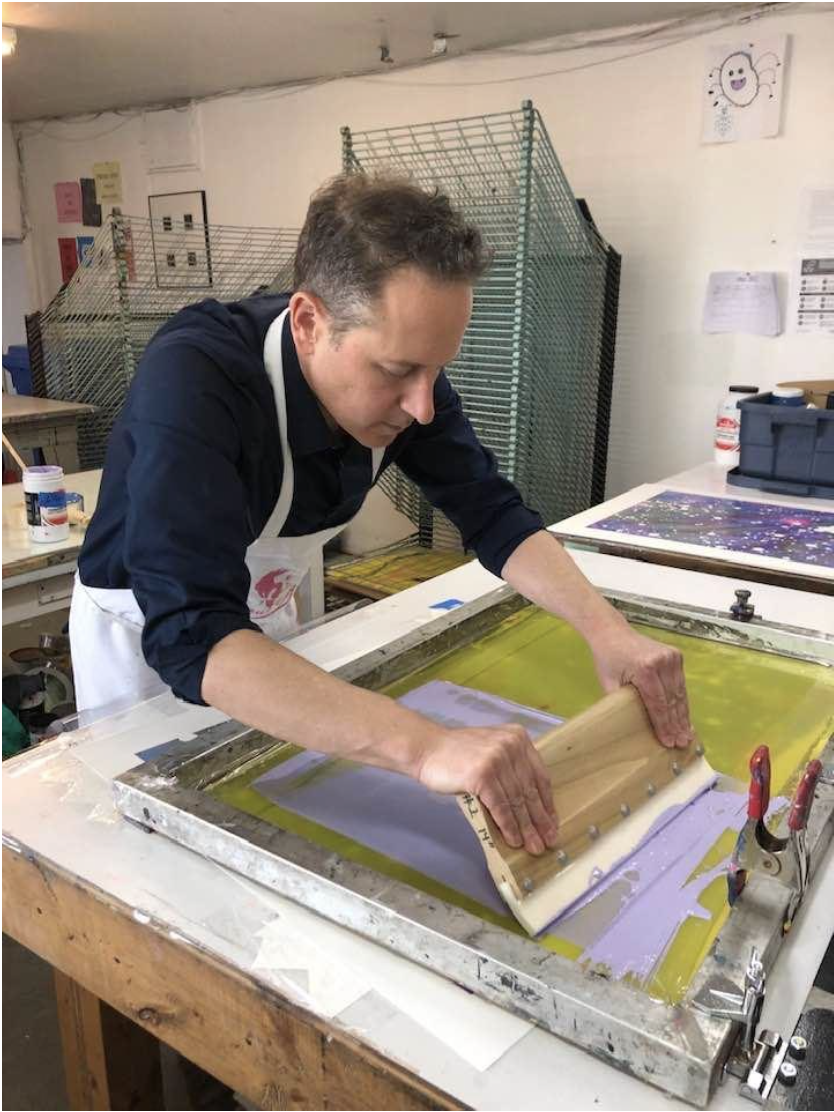 Meltz pulling a screenprint layer in lavender ink at Atelier Presse Papier